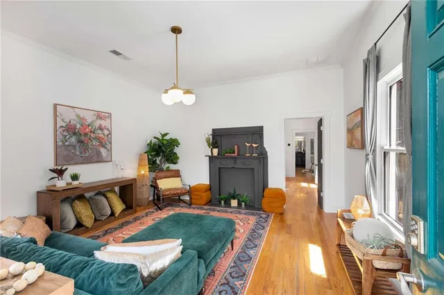 a living room with furniture and a fireplace