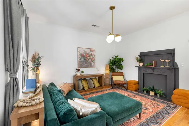 a living room with furniture and a fireplace