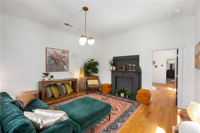 a living room with furniture a window and a fireplace