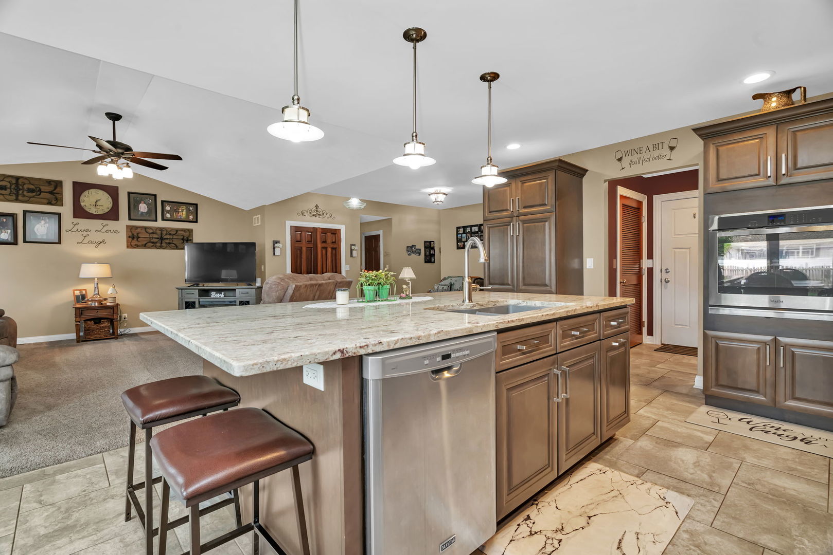 80 East Spring Road Coal City, IL 60416 - Photo 13 of 38 a large kitchen with granite countertop a stove a sink a oven a dining table and chairs