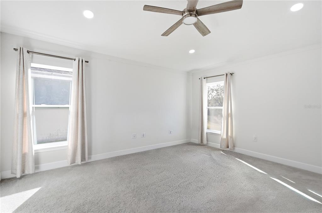 12945 Ogden Glade Road Dade City, FL 33525 - Photo 17 of 26 a view of an empty room with a window