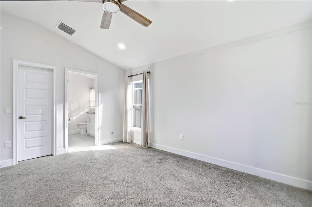 12945 Ogden Glade Road Dade City, FL 33525 - Photo 18 of 26 wooden floor in an empty room