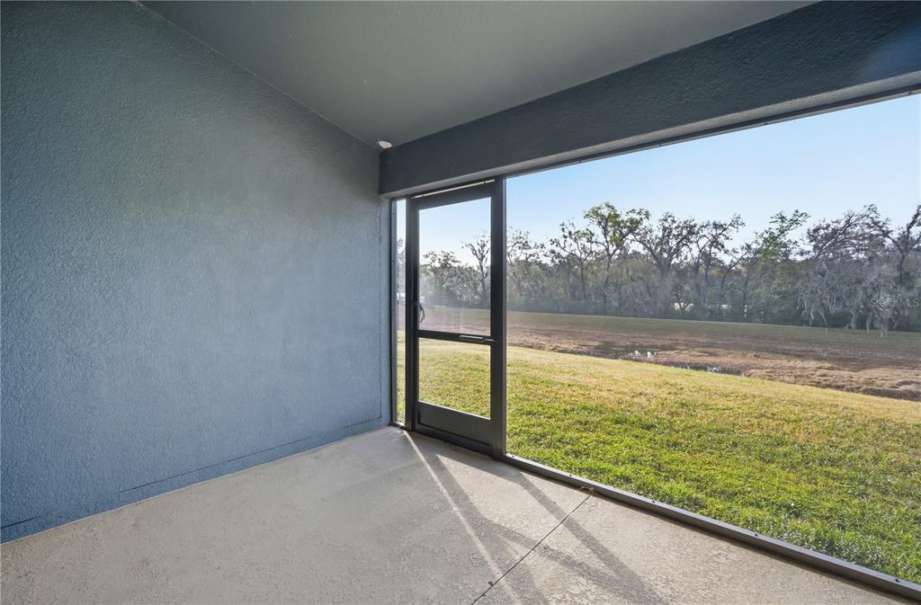 12945 Ogden Glade Road Dade City, FL 33525 - Photo 22 of 26 a view of a large window with an outdoor space
