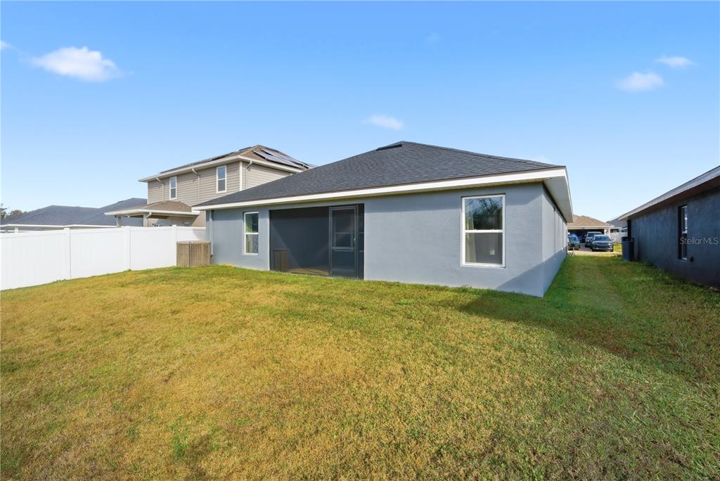 12945 Ogden Glade Road Dade City, FL 33525 - Photo 24 of 26 a front view of house with yard