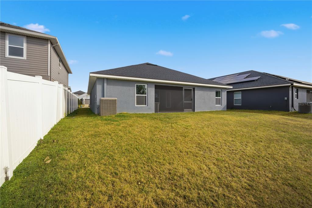 12945 Ogden Glade Road Dade City, FL 33525 - Photo 25 of 26 a front view of a house with yard