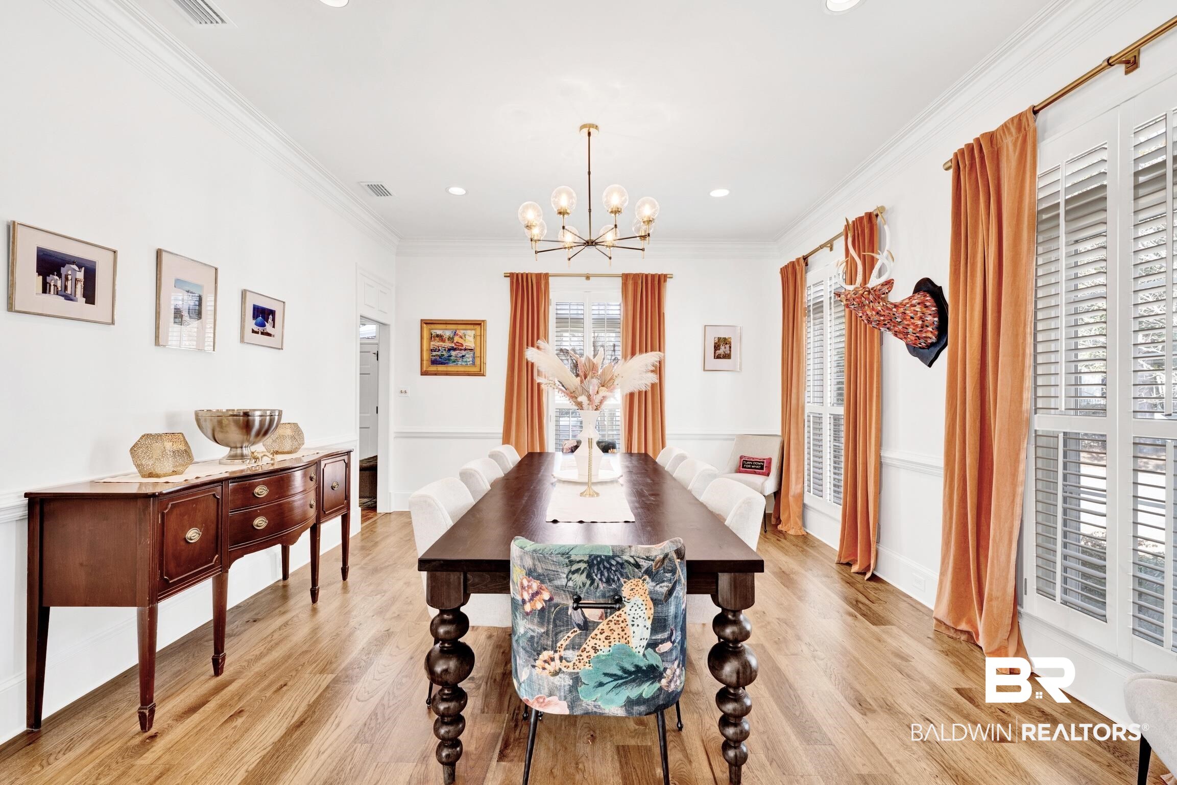 4 Savannah Court Mobile, AL 36608 - Photo 8 of 32 Dining area with ornamental molding, a chandelier, and light wood finished floors