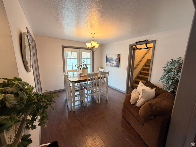 110 South 200 East Springville, UT 84663 - Photo 4 of 23 Dining area featuring a textured ceiling, dark wood-style flooring, and suspended lighting