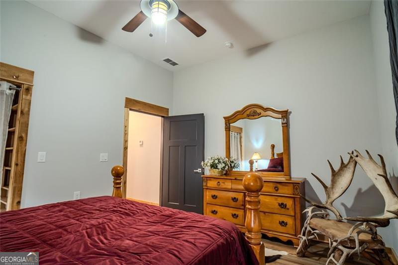 1700 Beaverdam Road Madison, GA 30650 - Photo 15 of 50 a bedroom with a bed and a dresser
