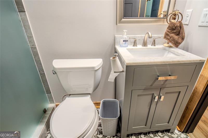 1700 Beaverdam Road Madison, GA 30650 - Photo 16 of 50 a white toilet sitting next to a sink