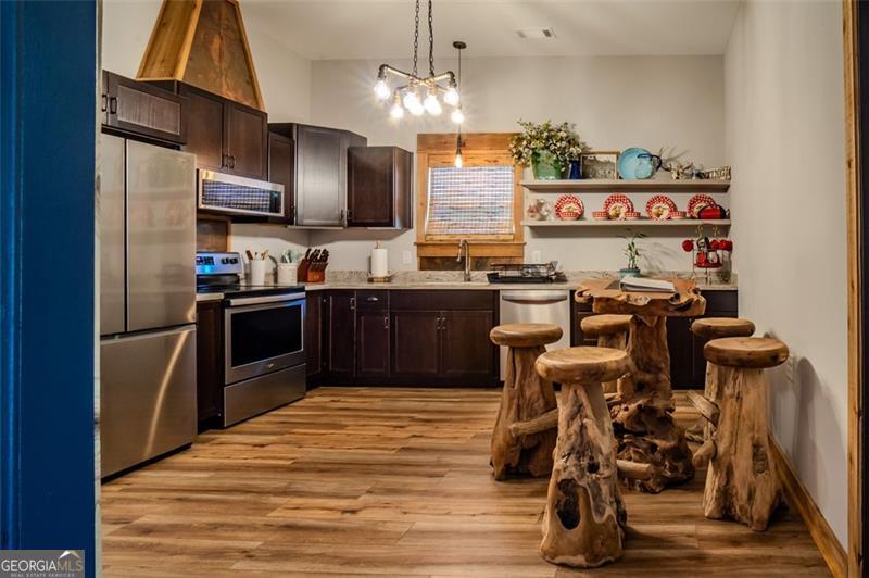 1700 Beaverdam Road Madison, GA 30650 - Photo 23 of 50 a kitchen with lots of appliances