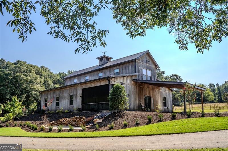 1700 Beaverdam Road Madison, GA 30650 - Photo 28 of 50 a front view of a house with garden