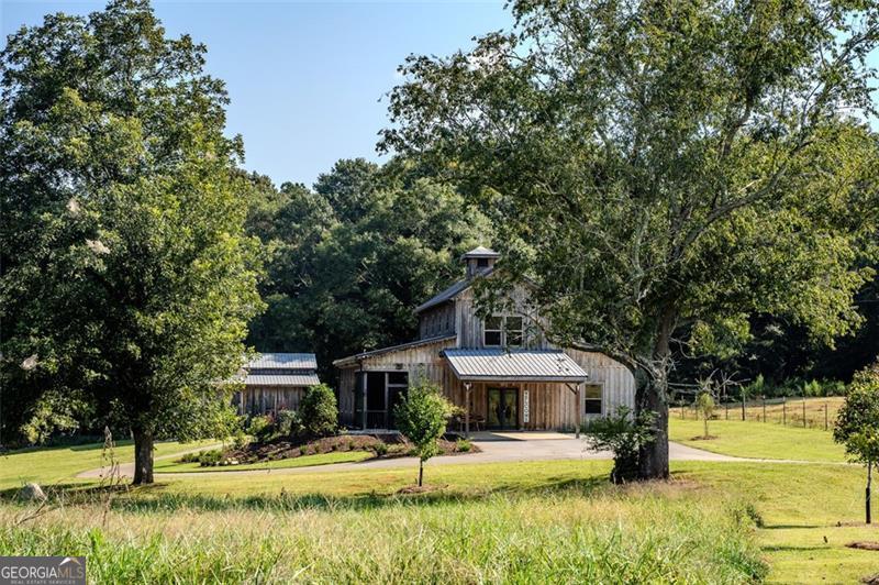 1700 Beaverdam Road Madison, GA 30650 - Photo 30 of 50 a front view of a house with a yard