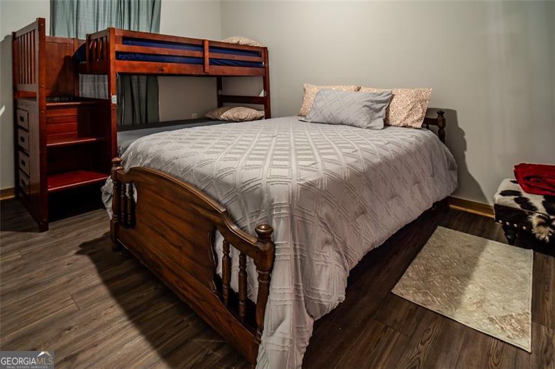 1700 Beaverdam Road Madison, GA 30650 - Photo 35 of 50 a bed sitting in a bedroom next to a window