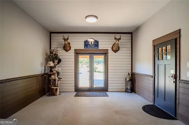 a view of a porch with a table and chairs