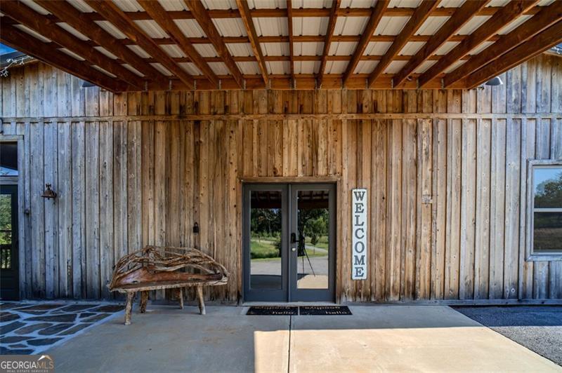 1700 Beaverdam Road Madison, GA 30650 - Photo 45 of 50 a backyard of a house with table and chairs