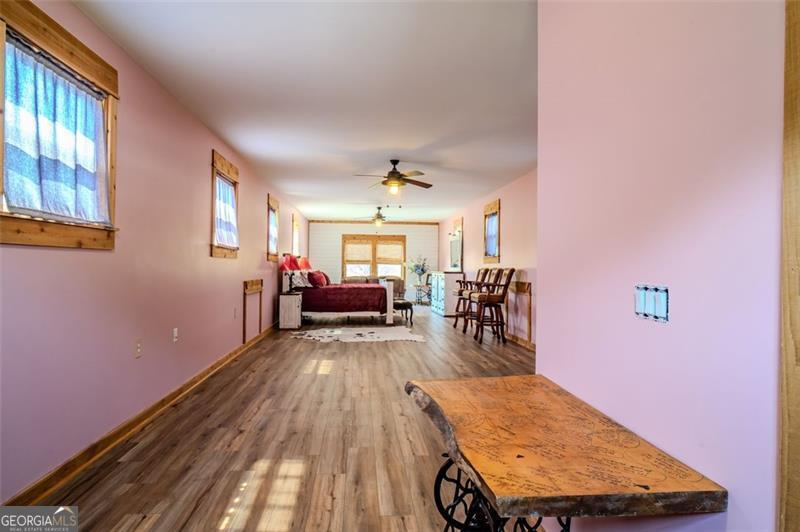 1700 Beaverdam Road Madison, GA 30650 - Photo 7 of 50 a view of a livingroom with furniture nad wooden floor