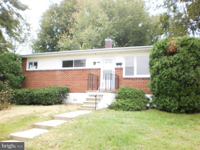 9027 Samoset Road Randallstown, MD 21133 - Photo 9 of 23 a view of a backyard with plants and large tree