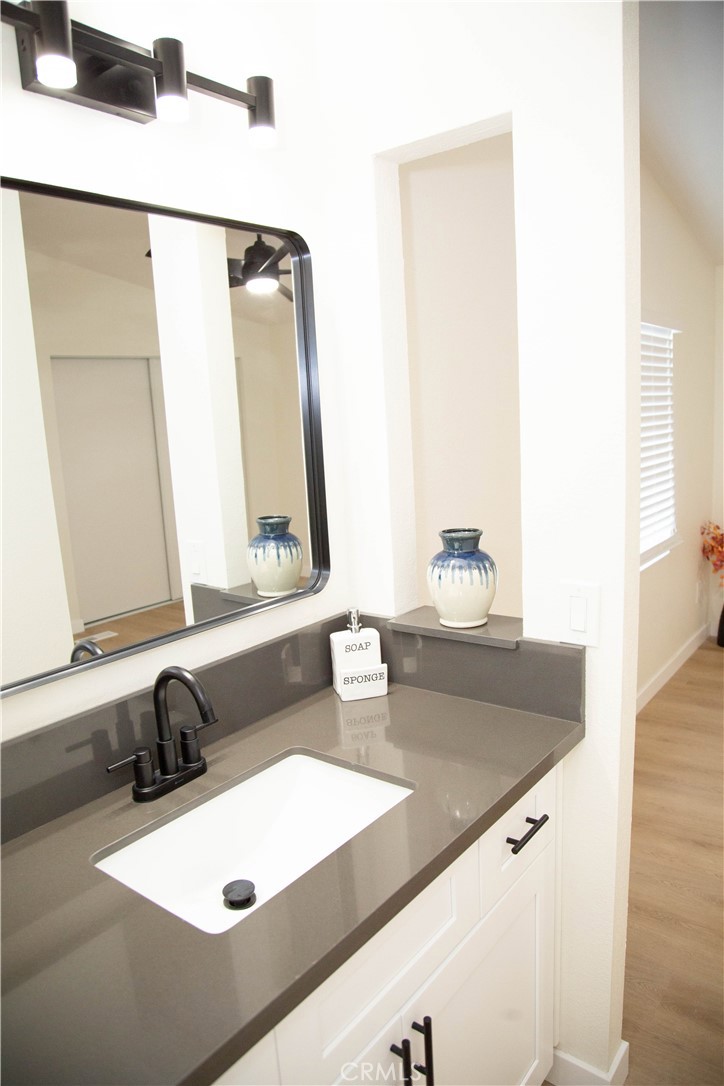 201 East Arrow Highway, Unit 73 Glendora, CA 91740 - Photo 15 of 43 a bathroom with a sink and a mirror