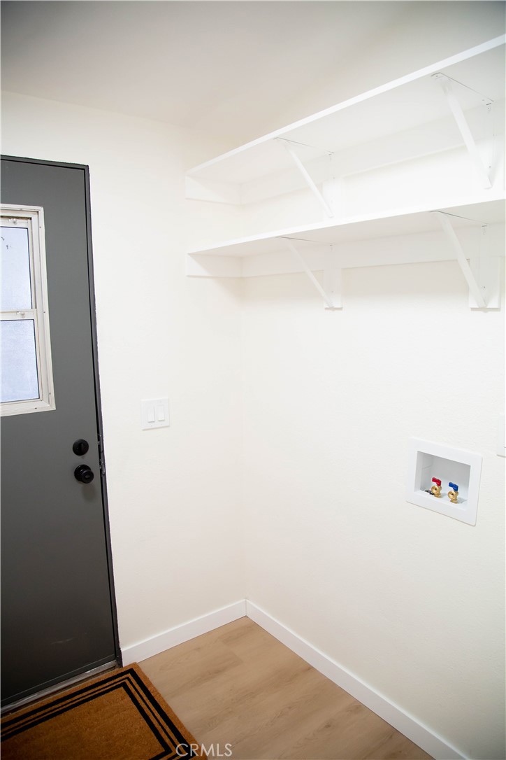 201 East Arrow Highway, Unit 73 Glendora, CA 91740 - Photo 19 of 43 a view of small space with racks on the wall