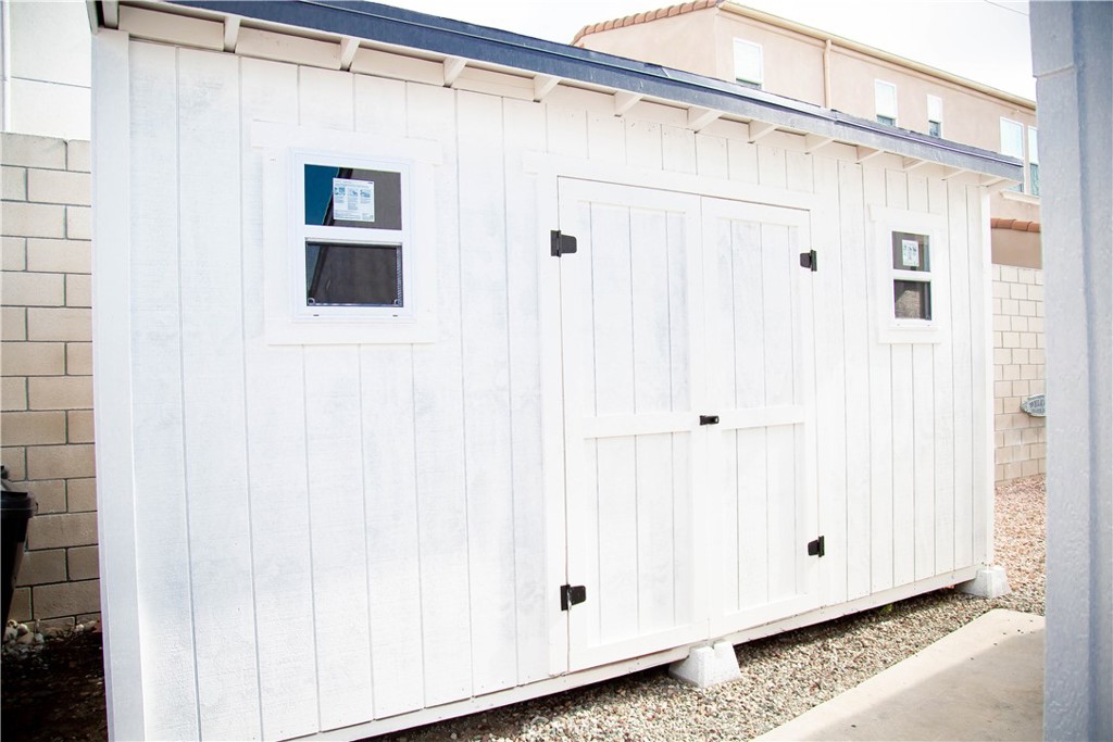 201 East Arrow Highway, Unit 73 Glendora, CA 91740 - Photo 23 of 43 a view of a back yard with wooden door