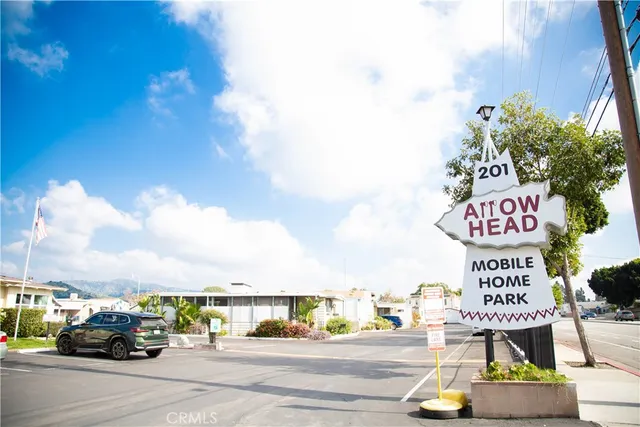 a view of street with parked cars