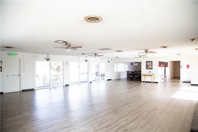 a view of a room with wooden floor