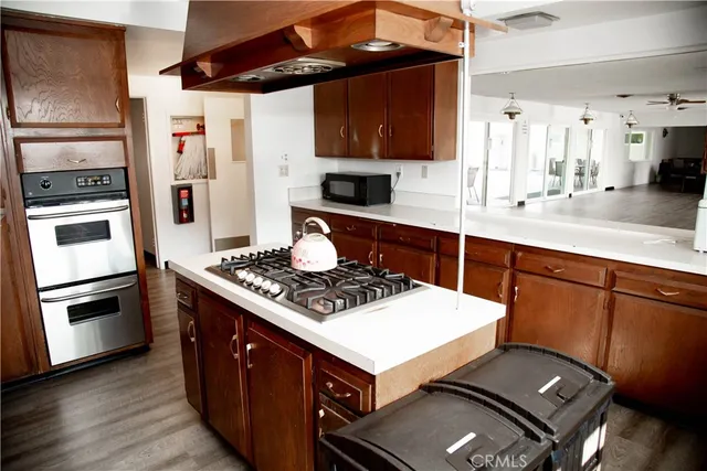 a kitchen with stainless steel appliances a refrigerator and a stove