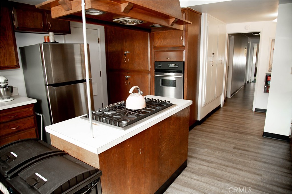 201 East Arrow Highway, Unit 73 Glendora, CA 91740 - Photo 35 of 43 a kitchen with stainless steel appliances a refrigerator and a stove
