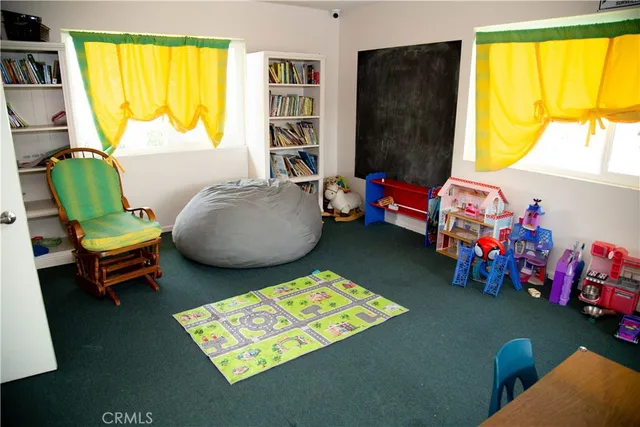 a room with furniture and air hockey table