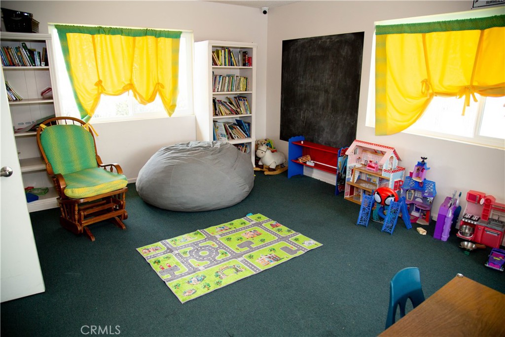 201 East Arrow Highway, Unit 73 Glendora, CA 91740 - Photo 40 of 43 a living room with furniture and a window