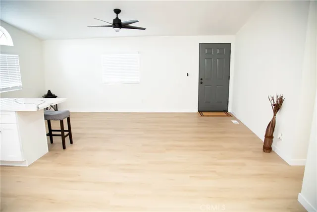 a view of a room with table and a chair