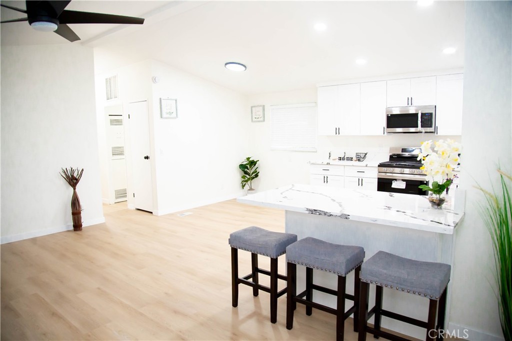 201 East Arrow Highway, Unit 73 Glendora, CA 91740 - Photo 7 of 43 a dining room with furniture and window