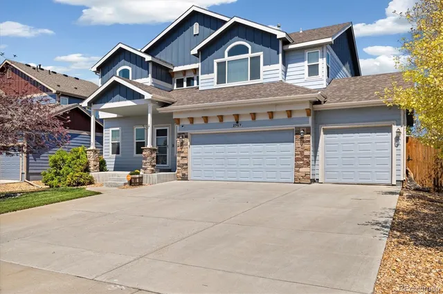 a view of a house with patio and garage