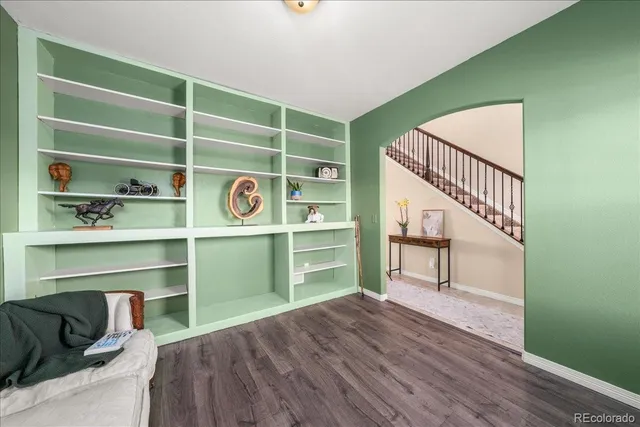 a view of a livingroom with furniture and a window