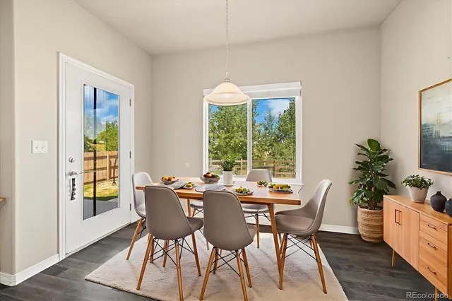 a view of a dining room with furniture window and outside view
