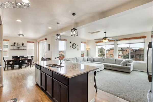a kitchen with living room and living room