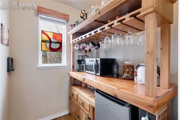 a kitchen with stainless steel appliances a sink and a microwave