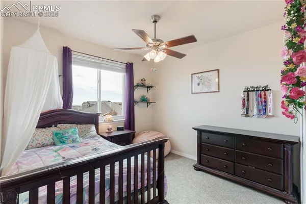 a room with furniture a window and a potted plant