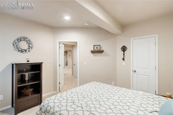 a bedroom with a bed and cabinets