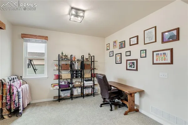 a workspace with a bookshelf