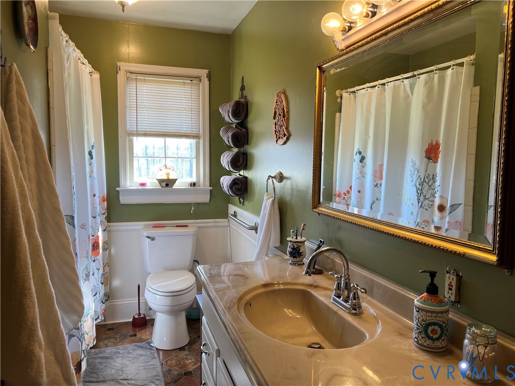 23381 Genito Road Jetersville, VA 23083 - Photo 17 of 54 a bathroom with a sink and a mirror
