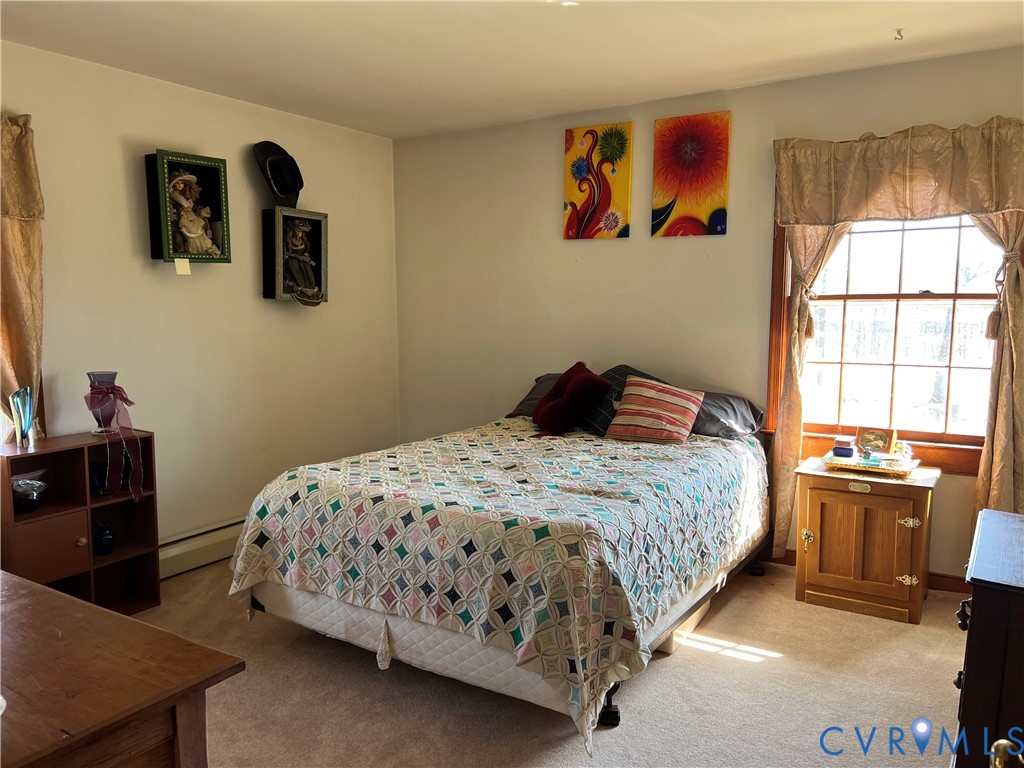 23381 Genito Road Jetersville, VA 23083 - Photo 18 of 54 a bedroom with a bed and a desk
