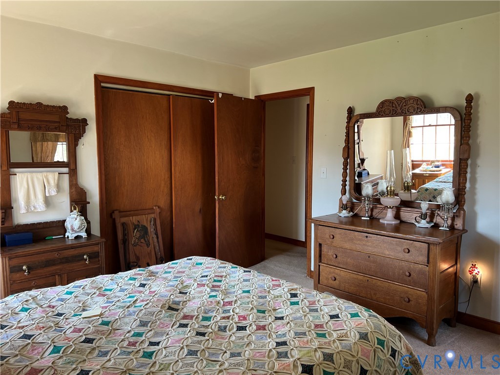 23381 Genito Road Jetersville, VA 23083 - Photo 19 of 54 a bedroom with a bed and a dresser