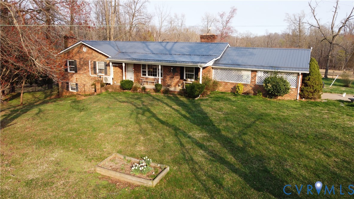 23381 Genito Road Jetersville, VA 23083 - Photo 27 of 29 Ranch-style house featuring a porch, a chimney, a
