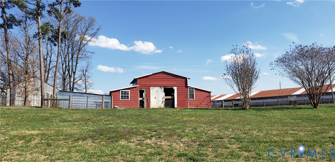 23381 Genito Road Jetersville, VA 23083 - Photo 42 of 54 a front view of a house with garden