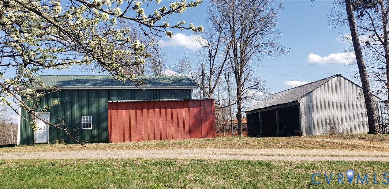 23381 Genito Road Jetersville, VA 23083 - Photo 5 of 29 a front view of a house with a yard and garage