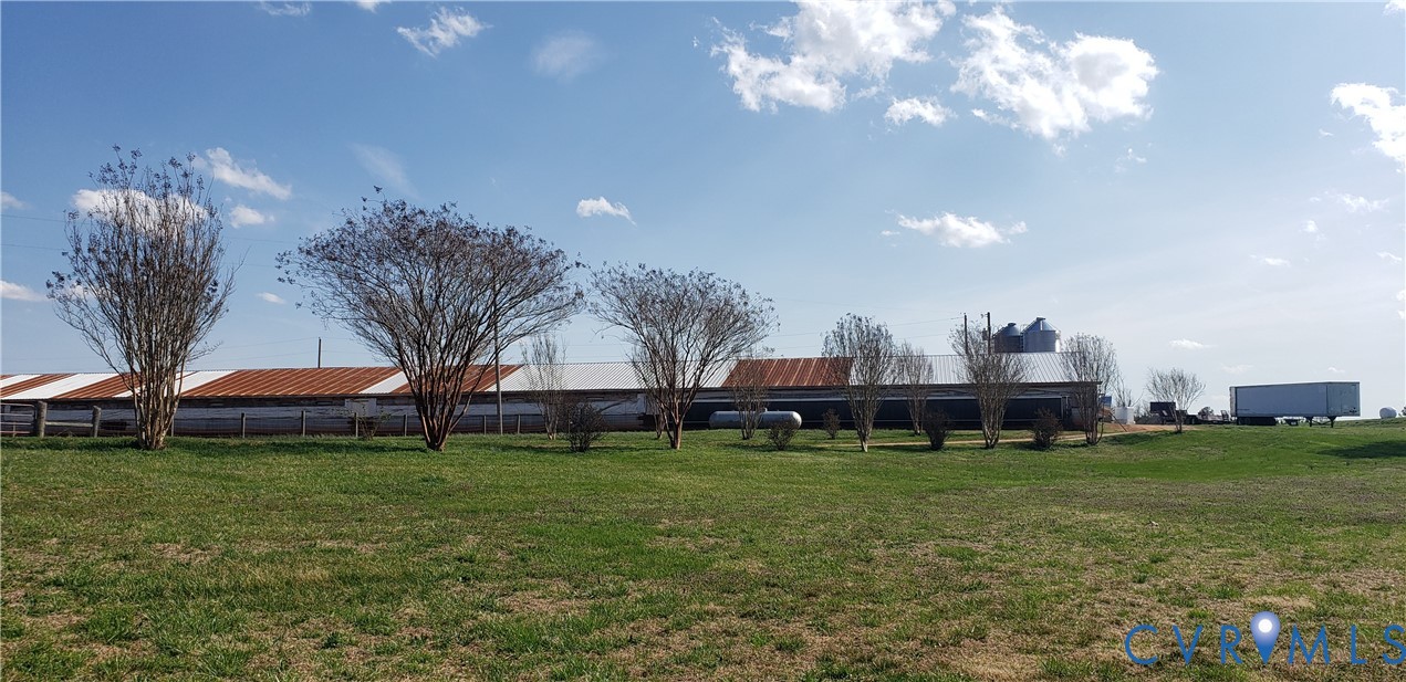 23381 Genito Road Jetersville, VA 23083 - Photo 10 of 29 a view of a house with a big yard and potted plants
