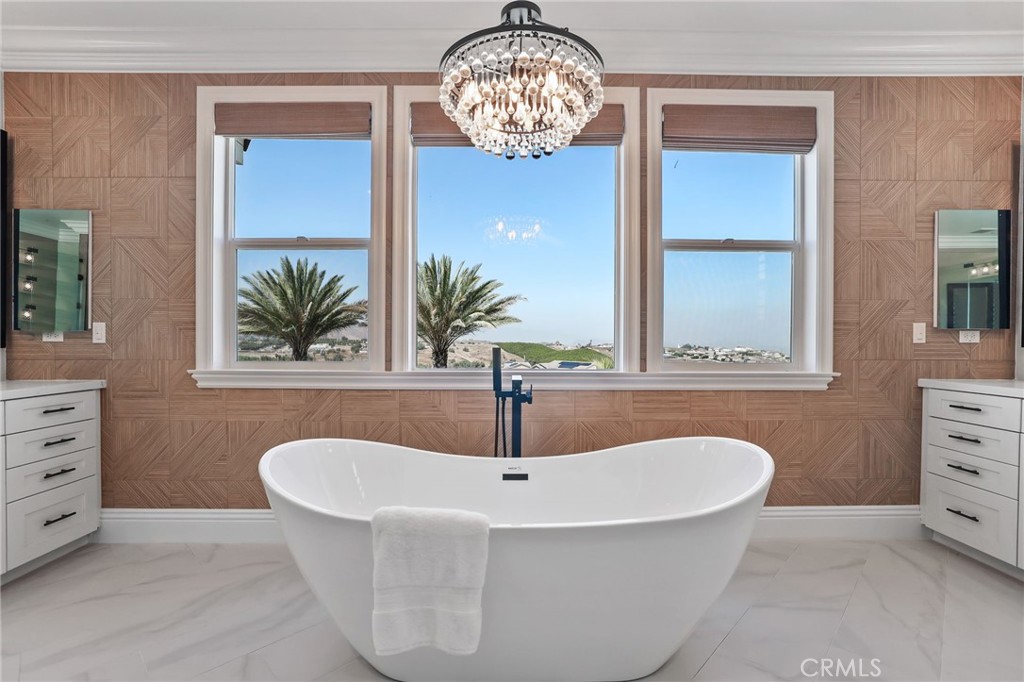 13430 Pointer Court Riverside, CA 92503 - Photo 38 of 55 a white bath tub sitting in a bathroom next to a window