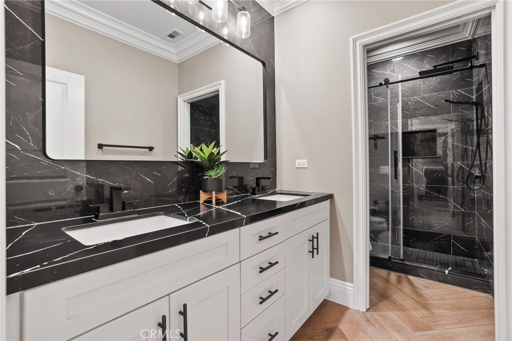 13430 Pointer Court Riverside, CA 92503 - Photo 46 of 55 a bathroom with a sink and a mirror