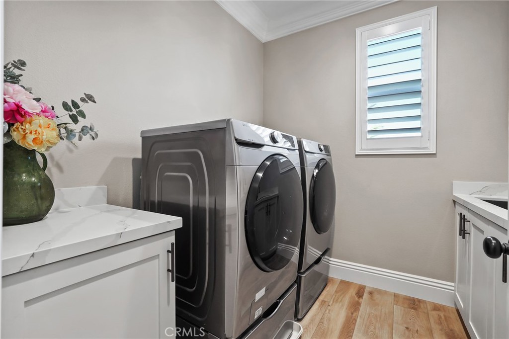 13430 Pointer Court Riverside, CA 92503 - Photo 48 of 55 a utility room with dryer and washer